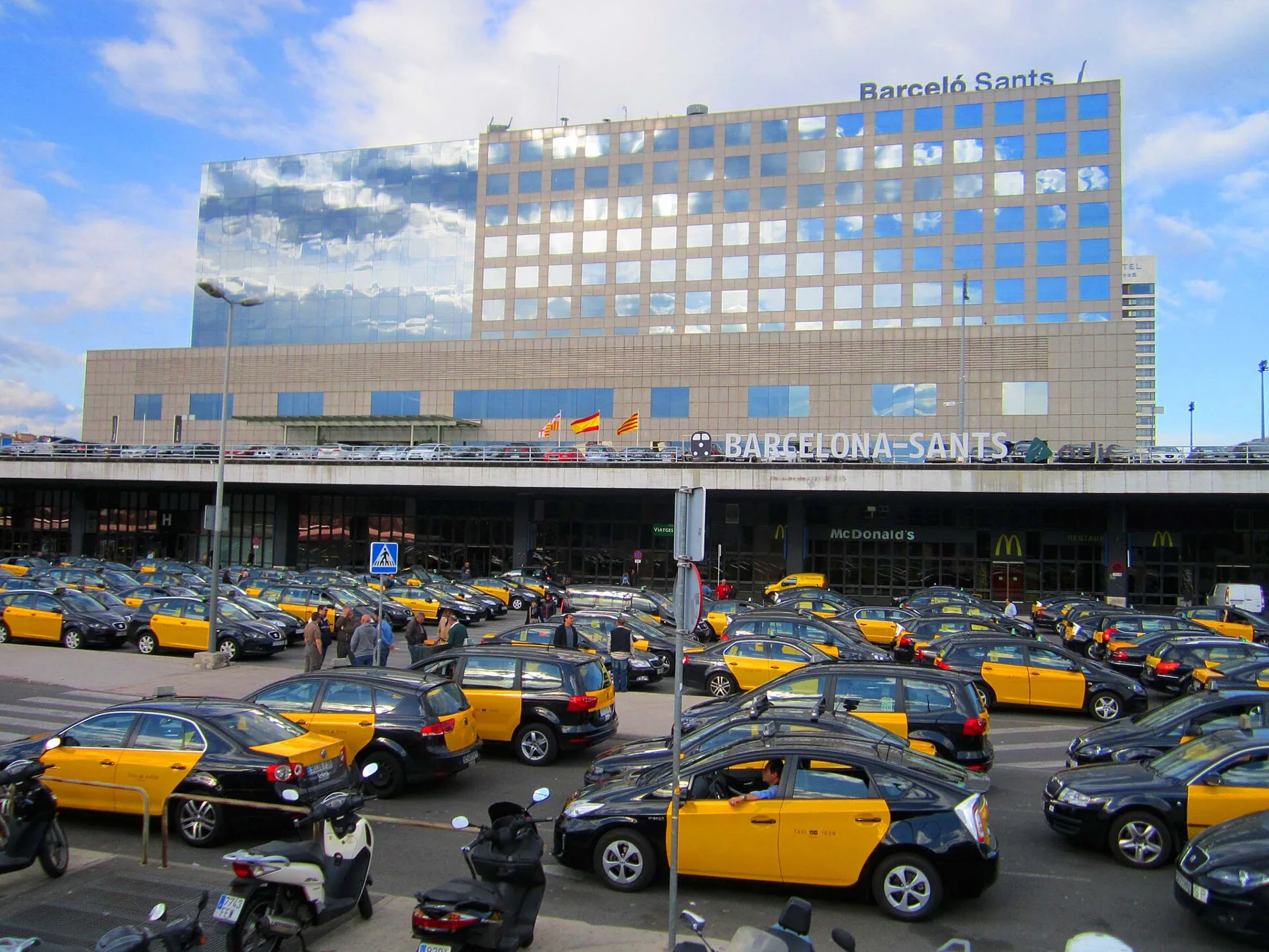 Barcelona-Sants train station and parking full of taxis,Spain