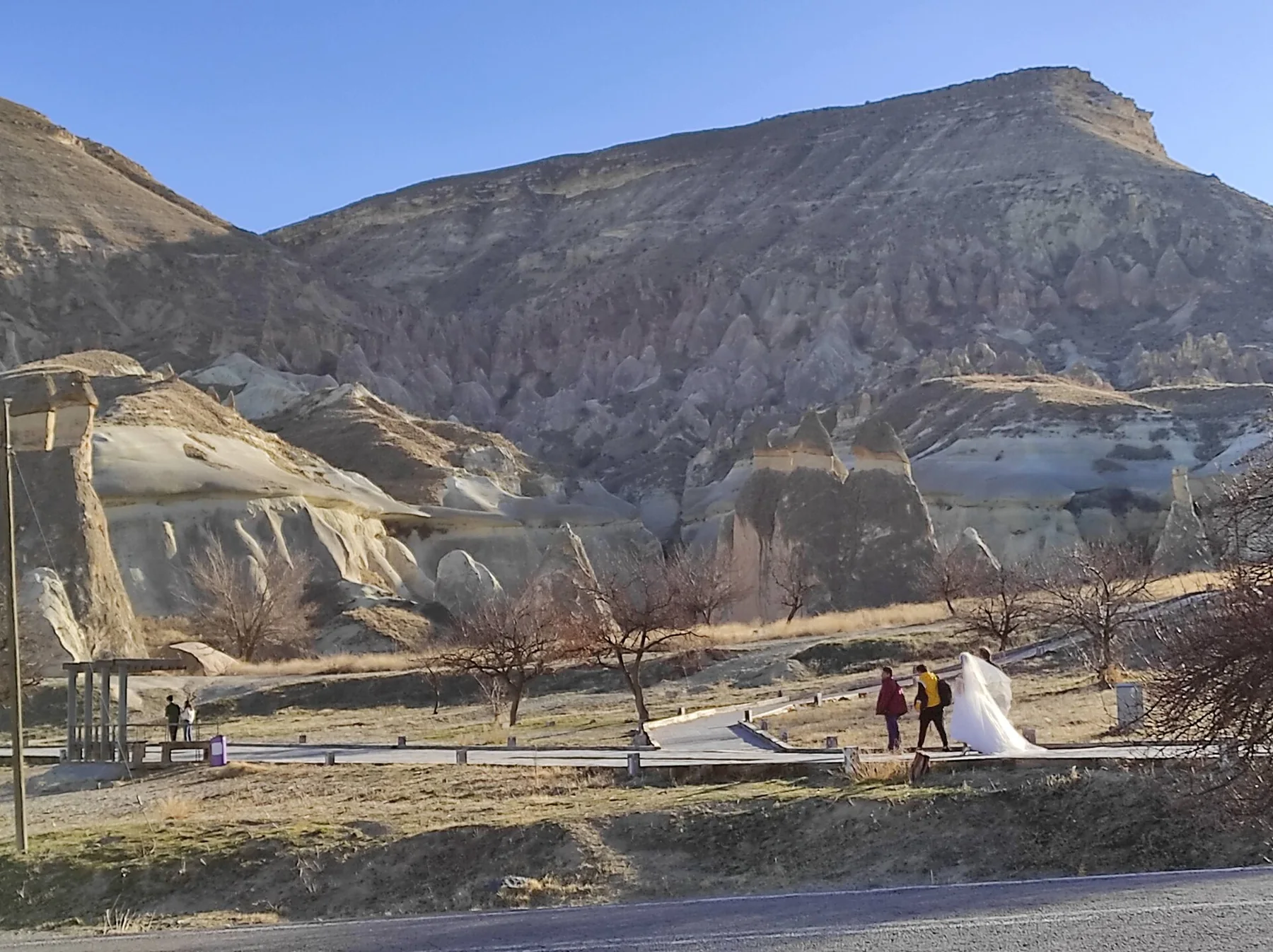 Bride and Maid, walking towards Fairy Chimneys in Cappadocia