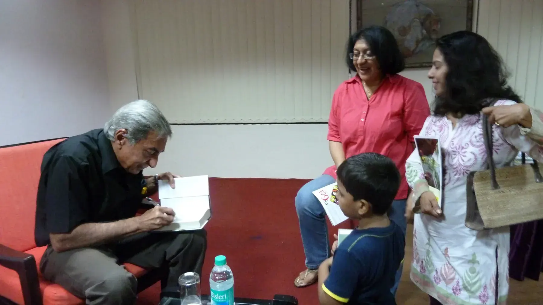 Indian journalist Jug Suriya, earlier of "Junior Statesman" (JS) and then with the "Times of India" signing copies of his book at a release function in Goa in 2011 05