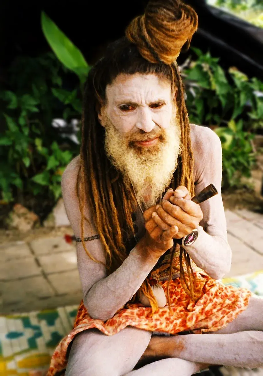 Indian sadhu at the Ganges River during the ritual smoking of marijuana, Rishikesh